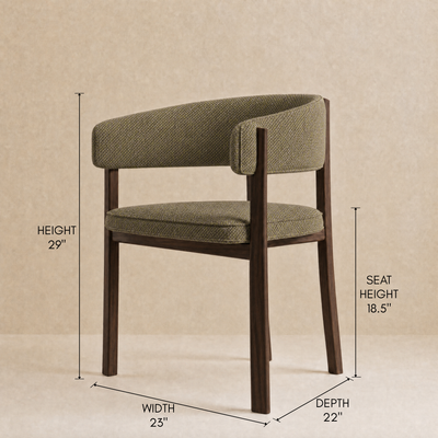 An upholstered dining chair with dark wood legs and curved backrest, shown with dimension callouts for height, seat height, width, and depth on a beige background.
