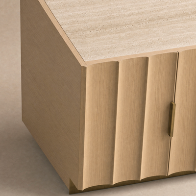Close-up of a modern sideboard or cabinet corner with fluted panel doors in a light natural wood finish, a textured stone top, and a slim brass handle.