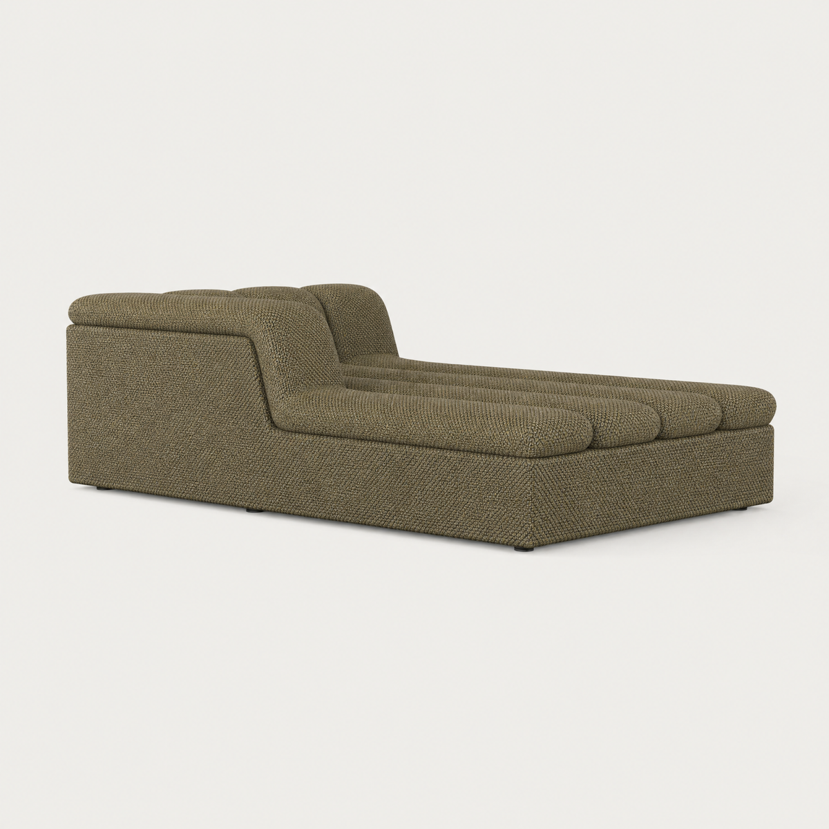 The Devi Chaise Module features textured Olive Green upholstery, a generous lounging surface, and a softly rounded backrest.