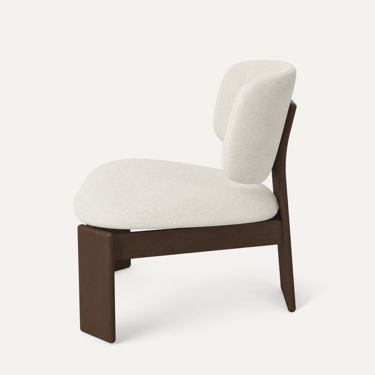Designed by Valerio Sommella, the Gaba Lounge Chair pairs generous cushioning with rounded Dark Oak detailing in the ACERKA Miami collection.