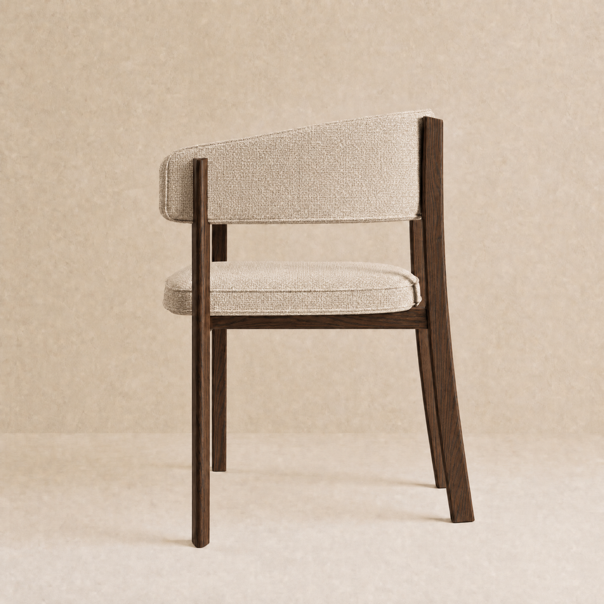 A modern dining chair with a dark brown wooden frame and textured light beige fabric upholstery on the seat and curved backrest, shown against a neutral beige textured background.